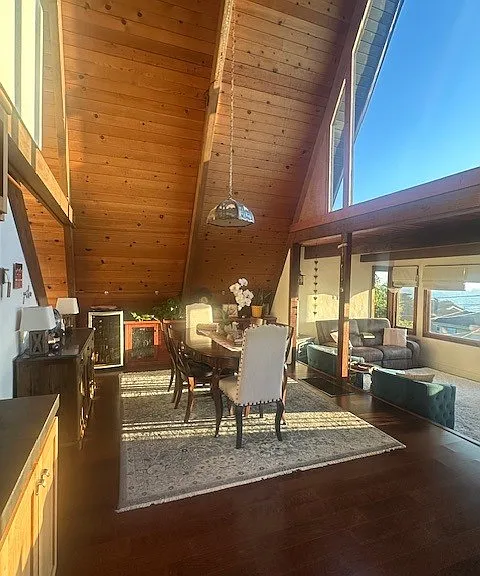 Sky high views, sunsets, starry nights, and moon settings over the sea. Looking as you enter front door, dining area and step down living area