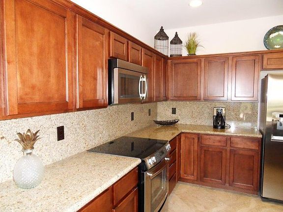 Granite countertops and stainless steel appliances.