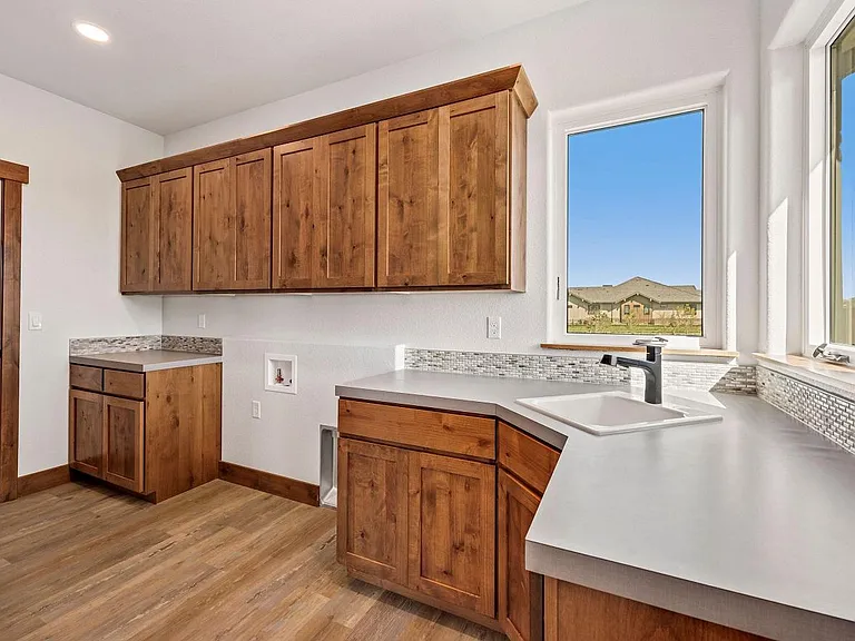 Laundry room with sink; gas and electric available