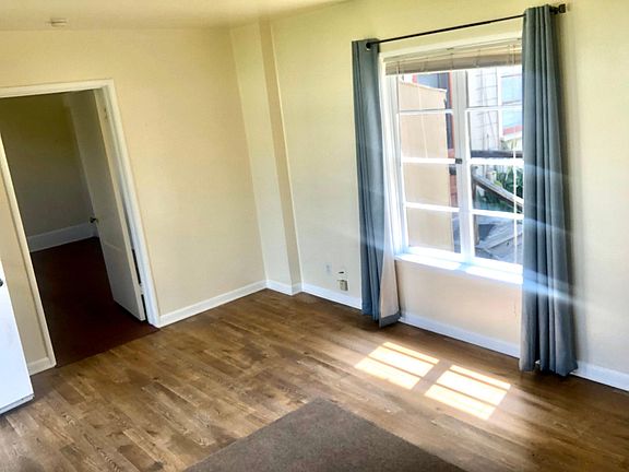 Living room with view through to bedroom