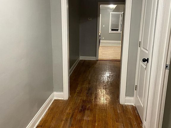 Hall leading to rear and kitchen