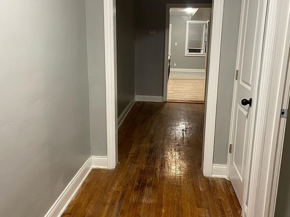 Hall leading to rear and kitchen