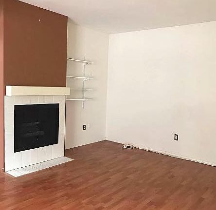 Spacious living room with fireplace.