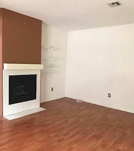 Spacious living room with fireplace.