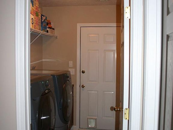 Laundry room with door to garage