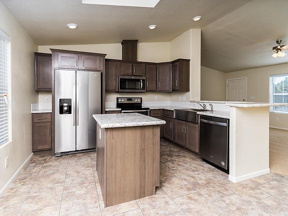 Kitchen - Solid wood cabinets, upgraded stainless appliance package, upgraded nickel hardware, large kitchen island, title back splashes, country farm sink, skylight, recessed lighting.