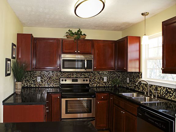 Stainless appliances and tile backsplash.