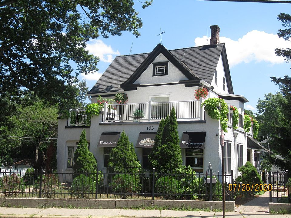 Front street side view of balcony and second and third floor apartment
