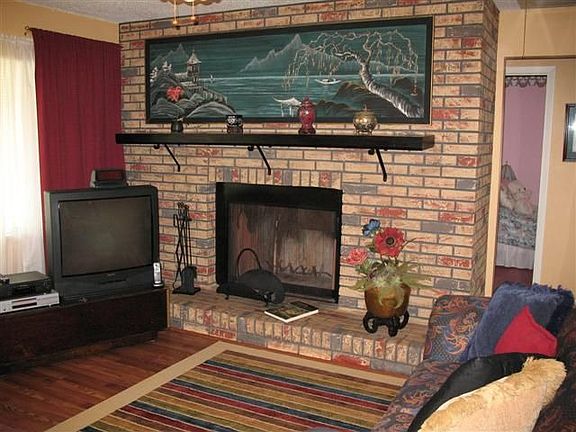 LIVING ROOM WITH WOOD BURNING FIREPLACE