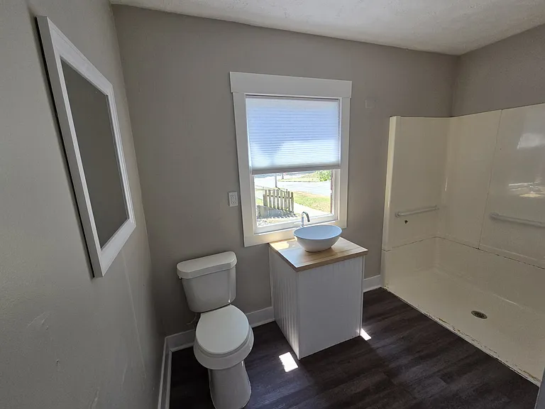 Main floor bedroom ensuite with walk in shower
