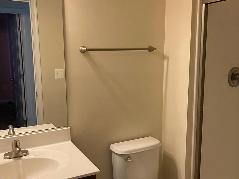 Full bath (shower only) right outside of lower level bedroom.