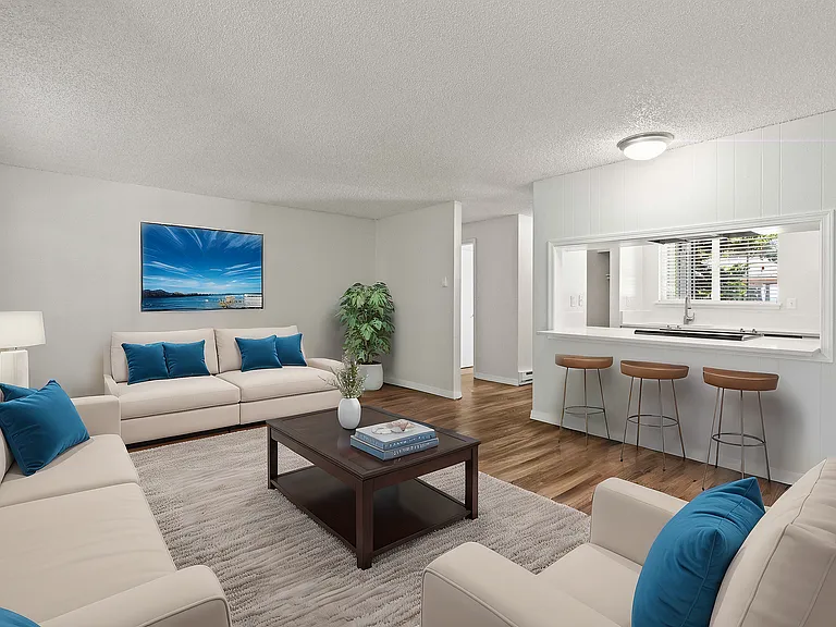 Experience the charm of this elegantly furnished living area with an open-concept kitchen.