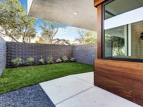 A view of the front garden also shows the privacy from the brick wall.