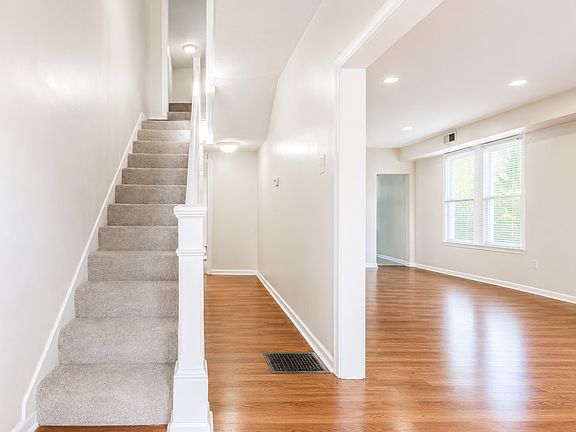 Bright open hallway with staircase