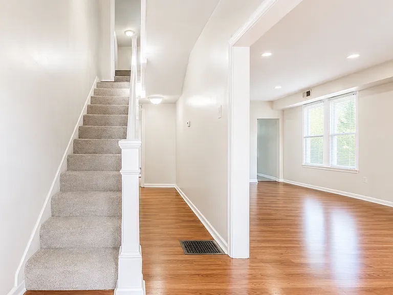 Bright open hallway with staircase