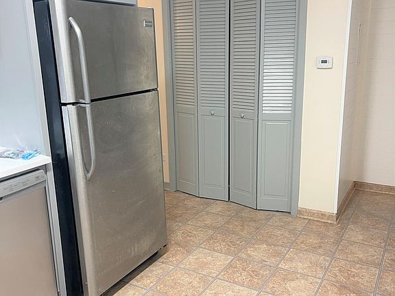 Brand New Built in Stainless Steel Refrigerator and Dishwasher.