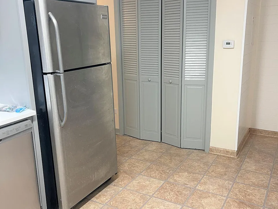 Brand New Built in Stainless Steel Refrigerator and Dishwasher.