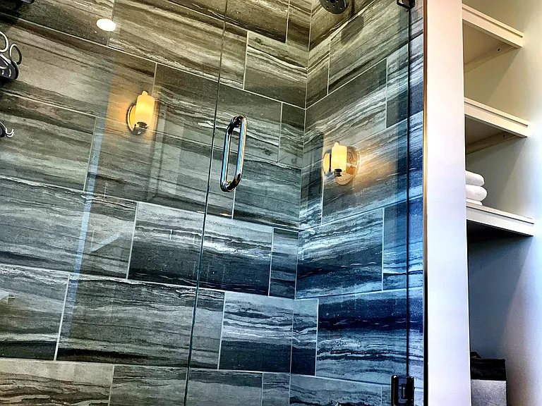 The large ceramic tile shower is the perfect way to begin and end a day.