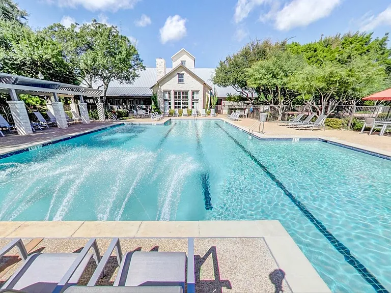 Resort Class Swimming Pool with lap lanes and poolside seating
