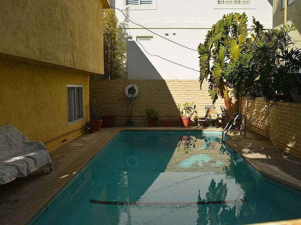 Swimming Pool next to green Common Area.