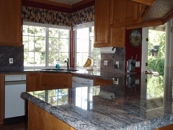 Open and bright kitchen with ample counter space. 