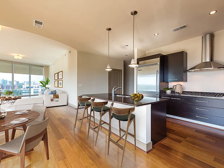 Open layout kitchen with a breakfast bar and pendant lighting