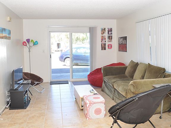 Living room looking toward kitchen, New tile floors will be installed before new lease starts.