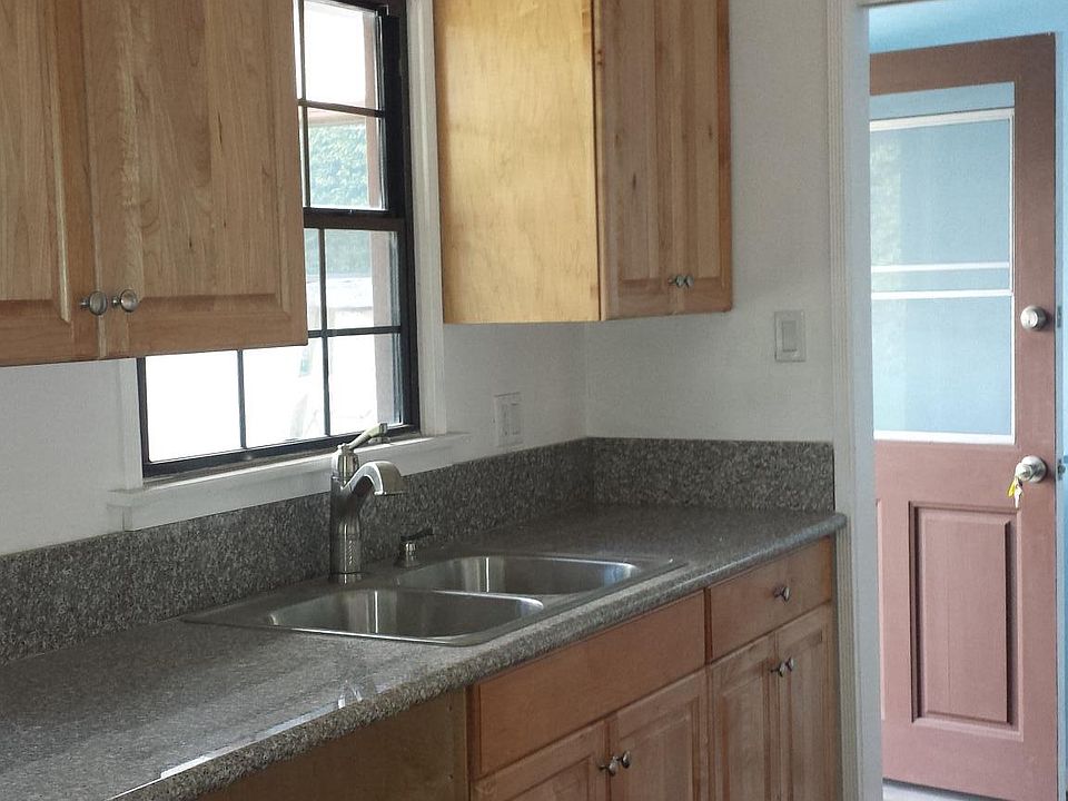 kitchen is at back of house photo shows open back door