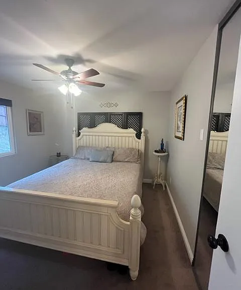 Master bedroom with ceiling fan, mirrored wardrobe, and ensuite bathroom.