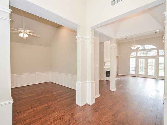 The rich wood flooring flows throughout the home and the high ceilings and architectural details are sure to impress.