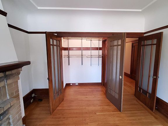 Living room or second bedroom with closet door open,