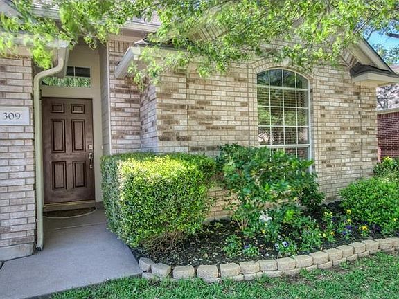Nicely finished front walkway with slip resistant entry.