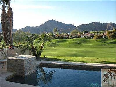 Pebble-Tec Pool with raised spa and firepit.