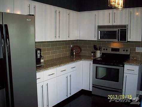 LARGE KITCHEN WITH PLENTY OF CABINETS AND COUNTER SPACE