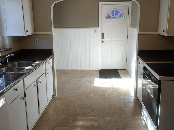 Big kitchen with electric range.