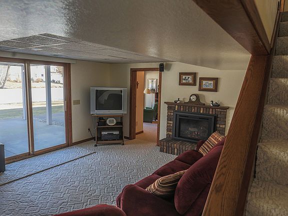 Part of family room looking out patio door to water