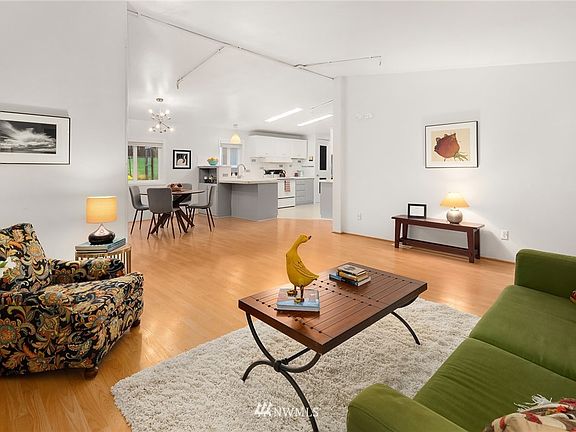 Another view of the great room looking beyond into the open kitchen.
