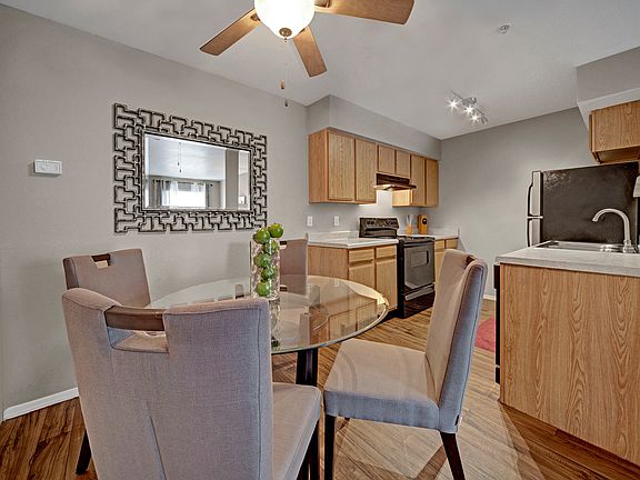 Dining Area with Ceiling Fan and Hardwood flooring