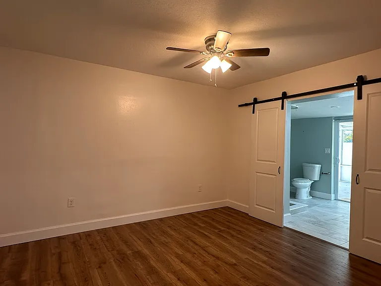large master bedroom and bathroom