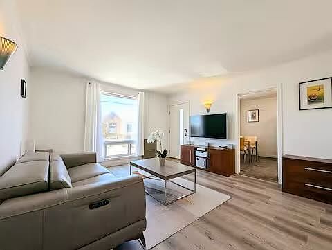 Living Area with leather reclining sofa, Large Smart TV & 5.1 theatre sound system