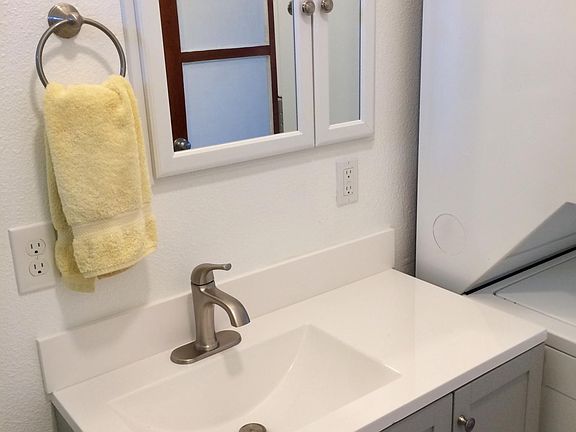 New 36" bathroom vanity, LED light bar and medicine cabinet. Stack washer dryer on right.