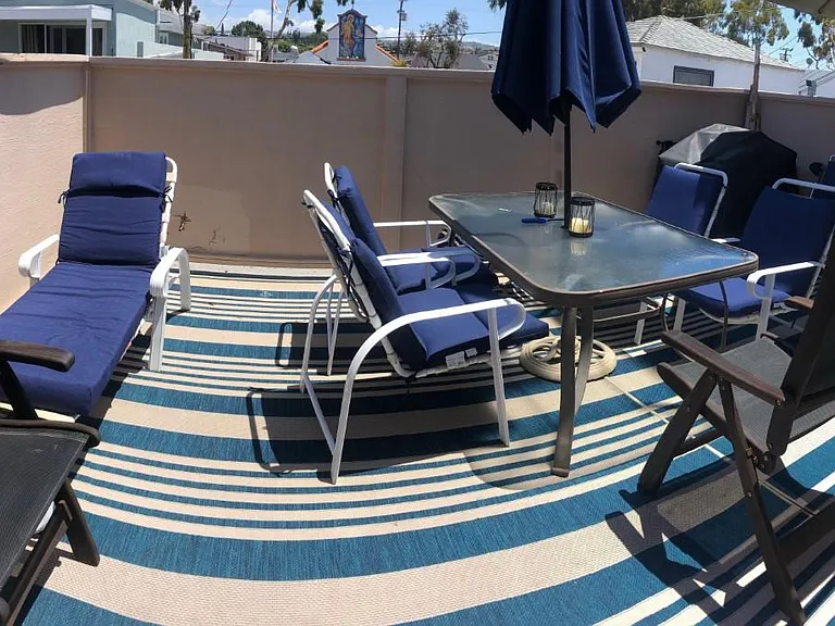 older picture of rear patio. Now has lattice for air flow and different mat.