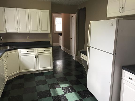 Kitchen includes dishwasher, built-in microwave, garbage dis