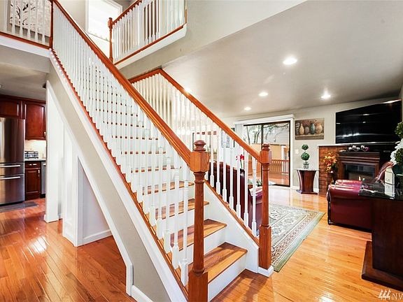 View from hallway -high ceiling and open staircase
