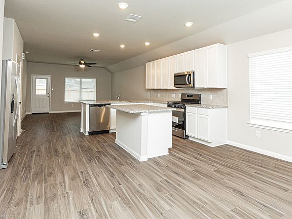 Dining Area to Kitchen and Family Room