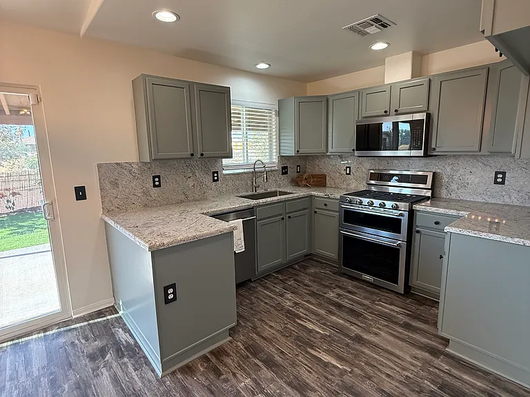 Granite countertop as well as matching granite backsplash