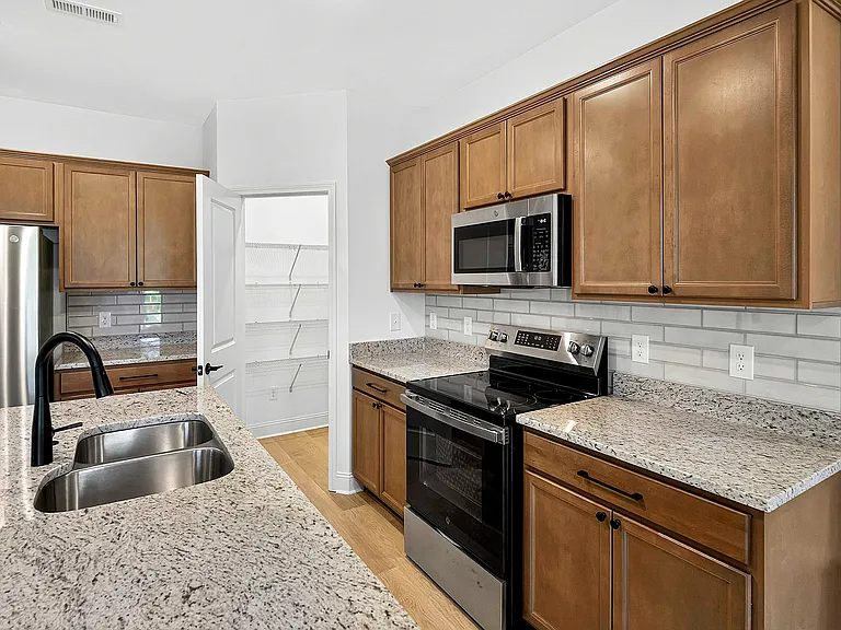 Designer tile backsplash and granite countertops