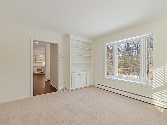 This room off the kitchen has a great view out to the back of the house through the bay window and i