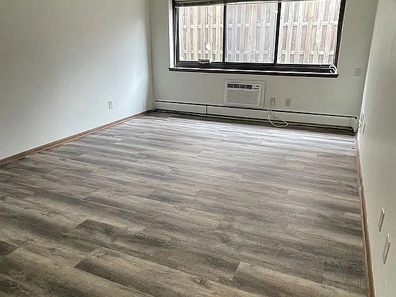 Transform your living space with the modern, open layout at LS Capital Group. Featuring elegant laminate flooring and abundant natural light, this room is perfect for your personal touch. Schedule a visit today to envision your new home!