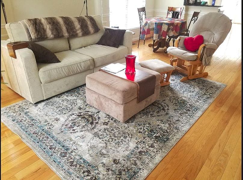 Large living room on main level with hardwood floors